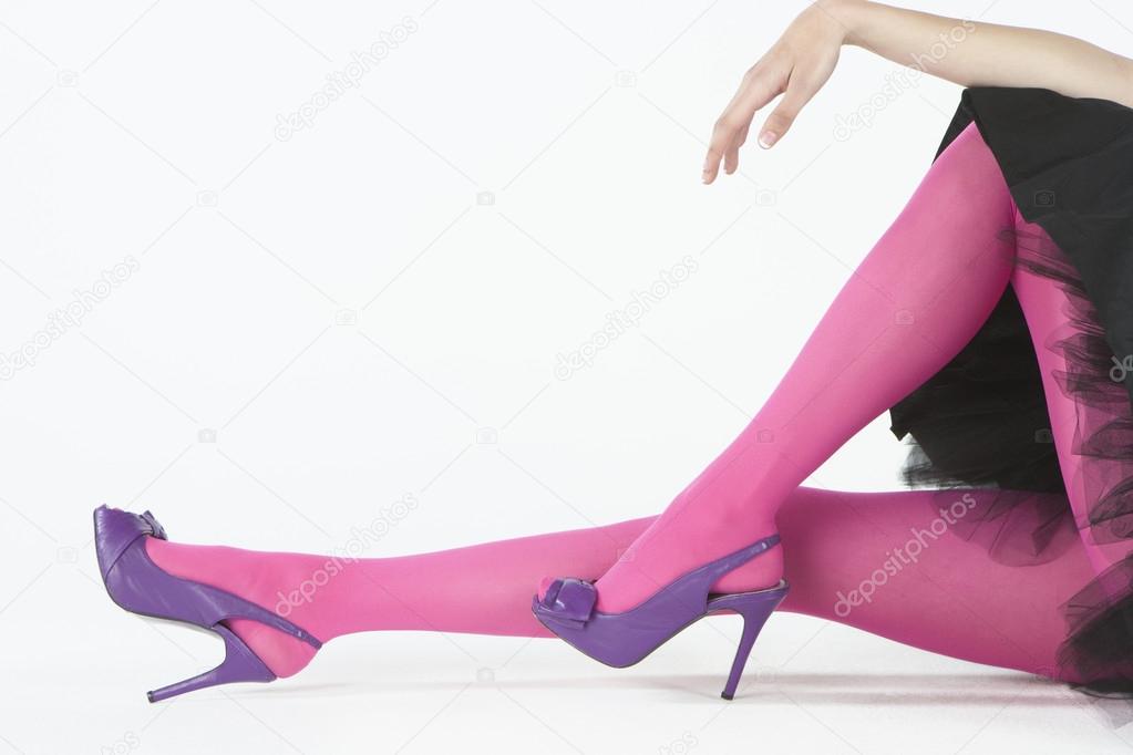 Fashion Model Wearing Pink Tights And Purple High Heeled Shoes