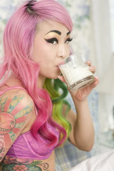 Young woman drinking milk — Stock Photo, Image