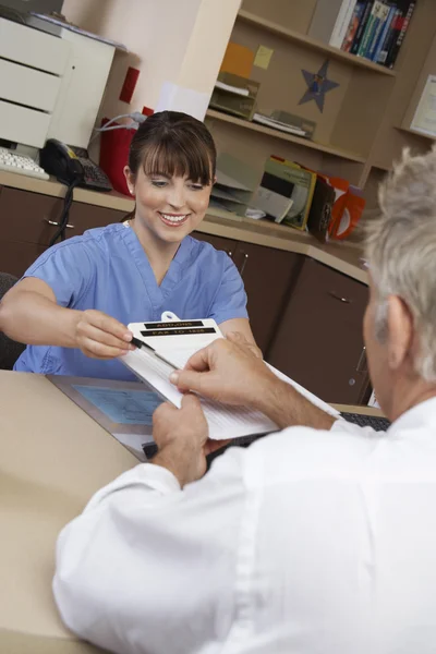 Nurse And Doctor Working In Office — Stock Photo, Image