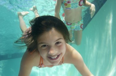 Girls Swimming Underwater