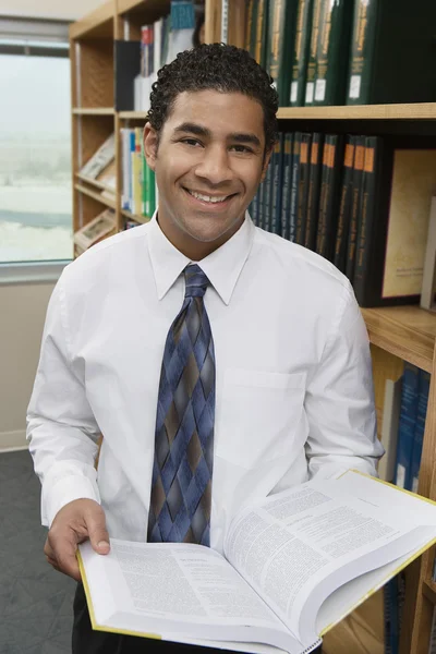 Businessman With Book At Library — Stock Photo, Image