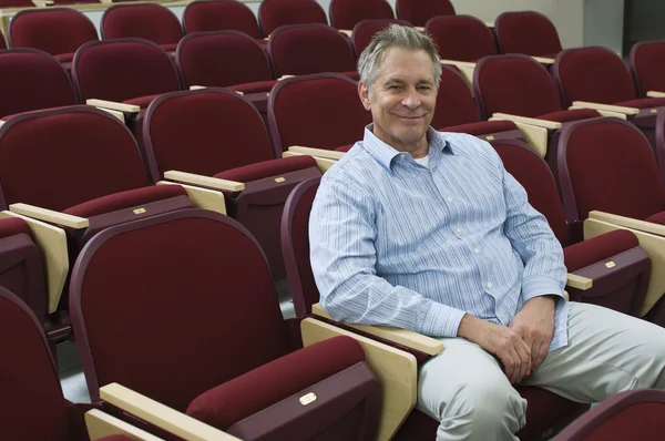 Man Sitting In Auditorium Chair — Stock Photo, Image