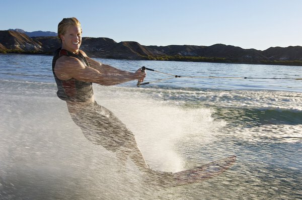 Man Wakeboarding On Lake