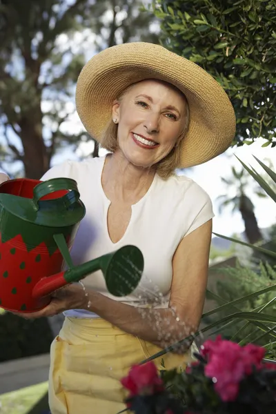 Senior Woman Watering Plants — Stock Photo, Image