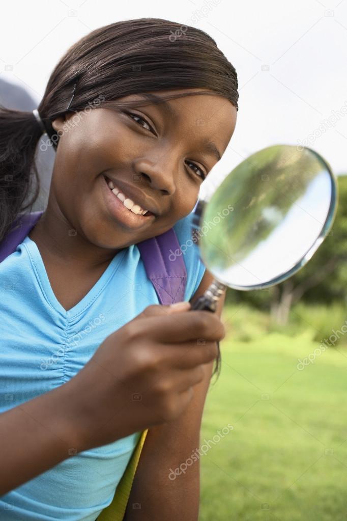 Girl Using Magnifying Glass