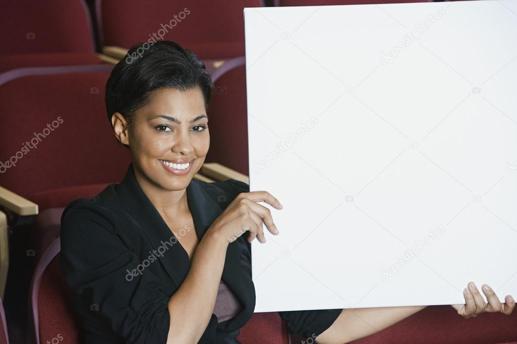 Businesswoman Holding Blank Placard