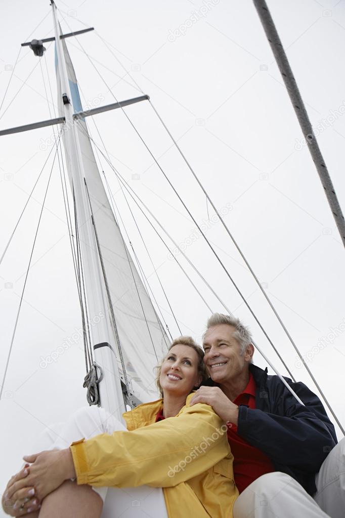 Couple Embracing On Sailboat
