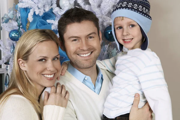 Couple With Son In Front Of Christmas Tree — Stock Photo, Image