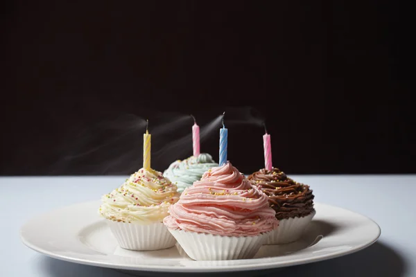 Cupcakes with birthday candles — Stock Photo, Image