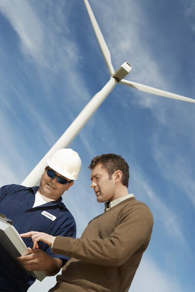 Engineers Working At Wind Farm