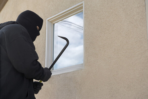 Burglar Breaking Into House