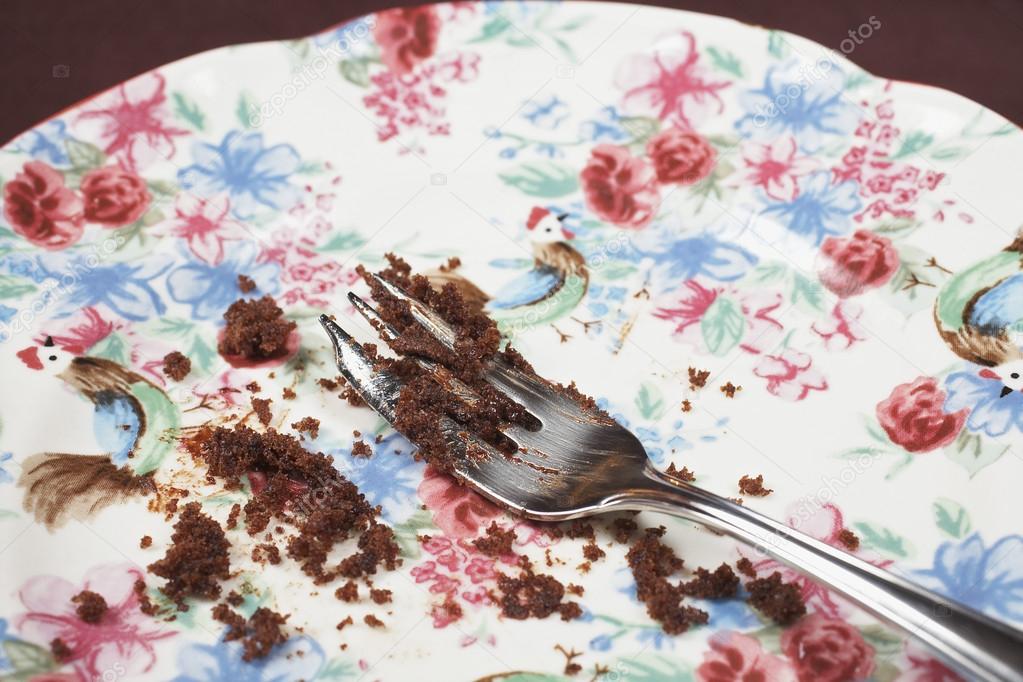 Fork And Cake Crumbs On Plate