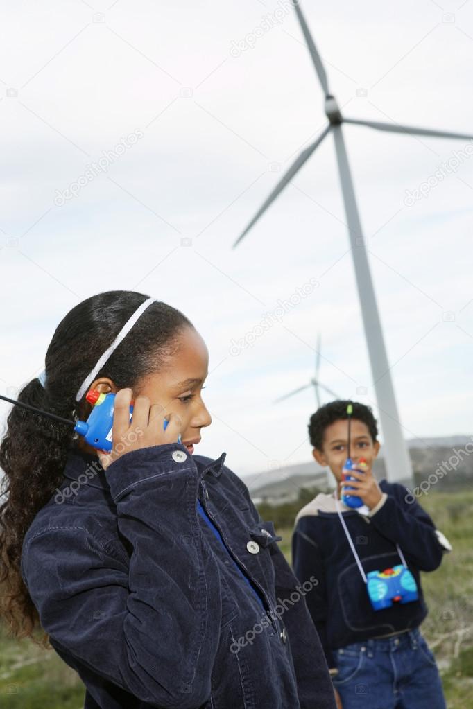 Boy And Girl Playing With Walkie-Talkies