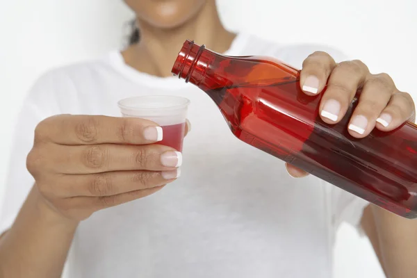 Woman Pouring Medicine — Stock Photo, Image