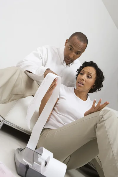 Couple Reading Adding Machine Tape — Stock Photo, Image