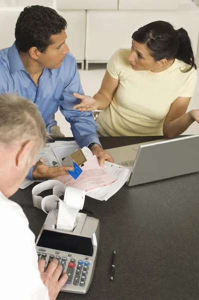 Advisor Printing Out Expenses While Couple Arguing For Bills — Stock Photo, Image