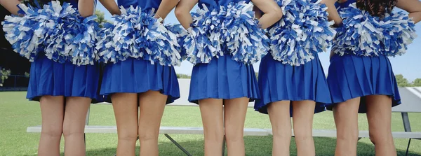 Cheer leader holding POM-POM — Foto Stock