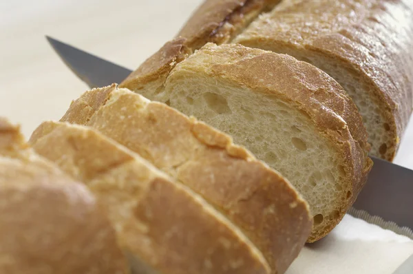 Knife Slicing Baguette — Stock Photo, Image