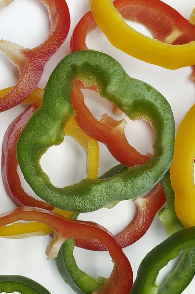 Různobarevné papriky výseče — Stock fotografie