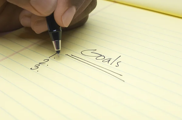 Hand Writing List Of goals On Notepad — Stock Photo, Image