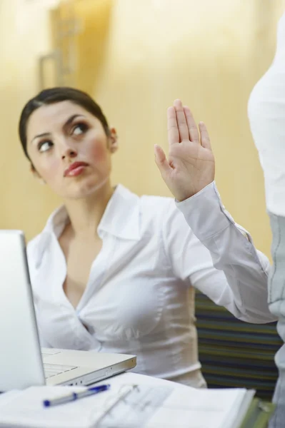 Businesswoman Showing Stop Gesture To Her Colleague — Stock Photo, Image