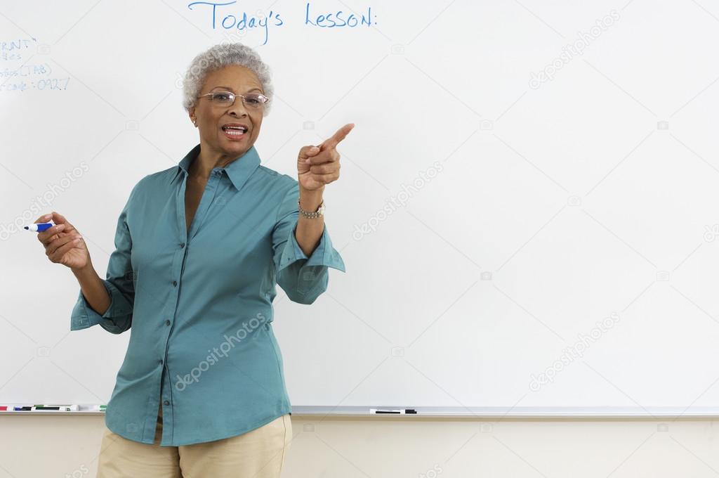 Teacher Explaining In The Classroom