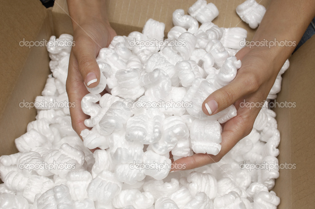 Hands Holding Heap Of Packing Peanuts