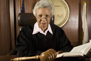 Judge Sitting With Book clipart