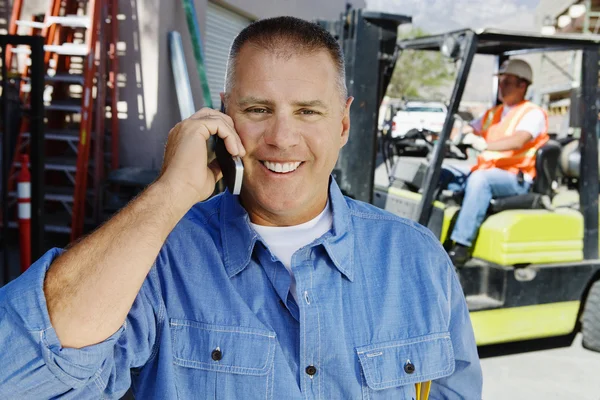 Workman Using Cell Phone — Stock Photo, Image