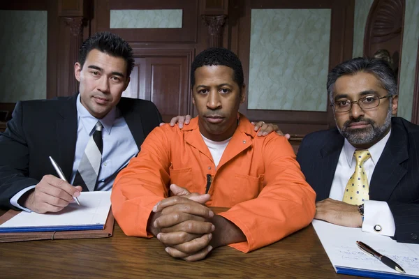 Criminal And Lawyers Sitting In Courtroom — Stock Photo, Image