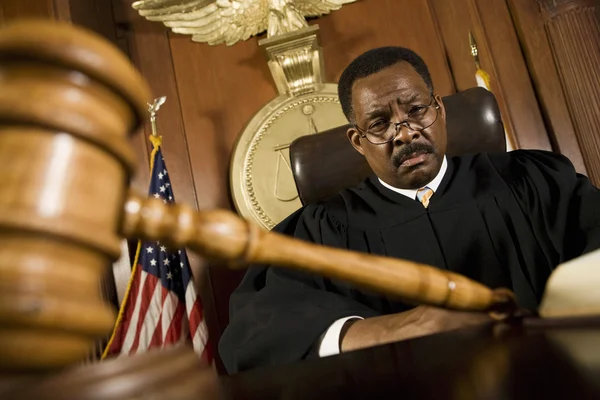 Wooden Gavel In Front Of judge — Stock Photo, Image