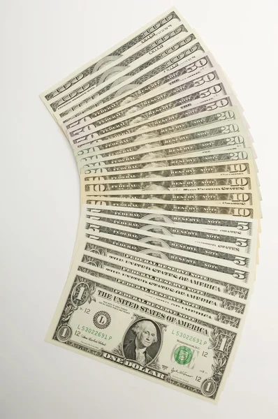 Dólares arreglados aislados sobre blanco —  Fotos de Stock