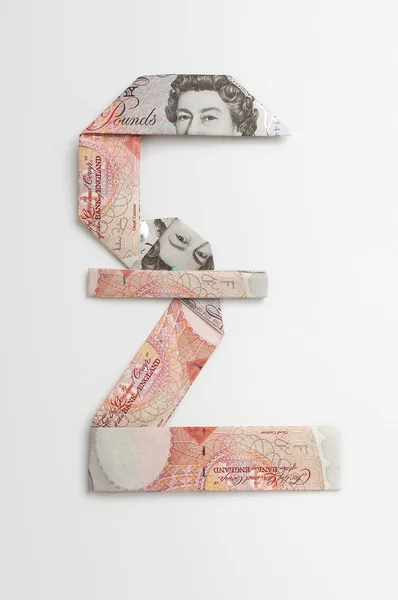 Pound Sterling Symbol Made Of Folded Banknotes — Stock Photo, Image