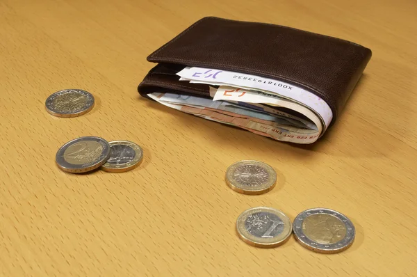 Wallet Full Of Money And Coins On Table — Stock Photo, Image