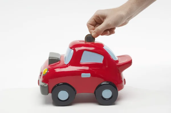 Hand Inserting Coin In Toy Car — Stock Photo, Image