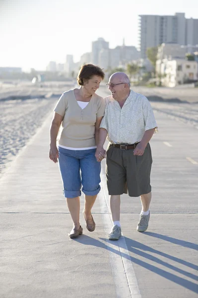 Senior Couple On Footpath Along Beach — Stock Photo, Image