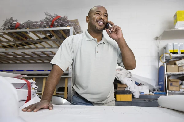 Male Architect Using Cell Phone Stock Image