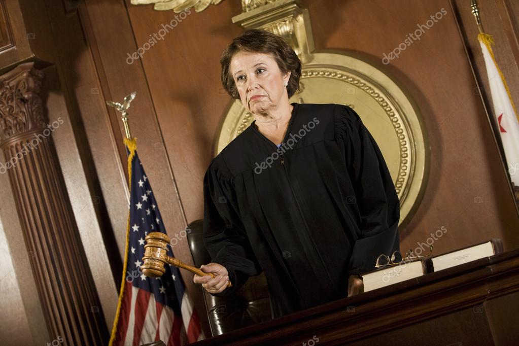 Female Judge Forming A Judgment Stock Photo by ©londondeposit 21972791