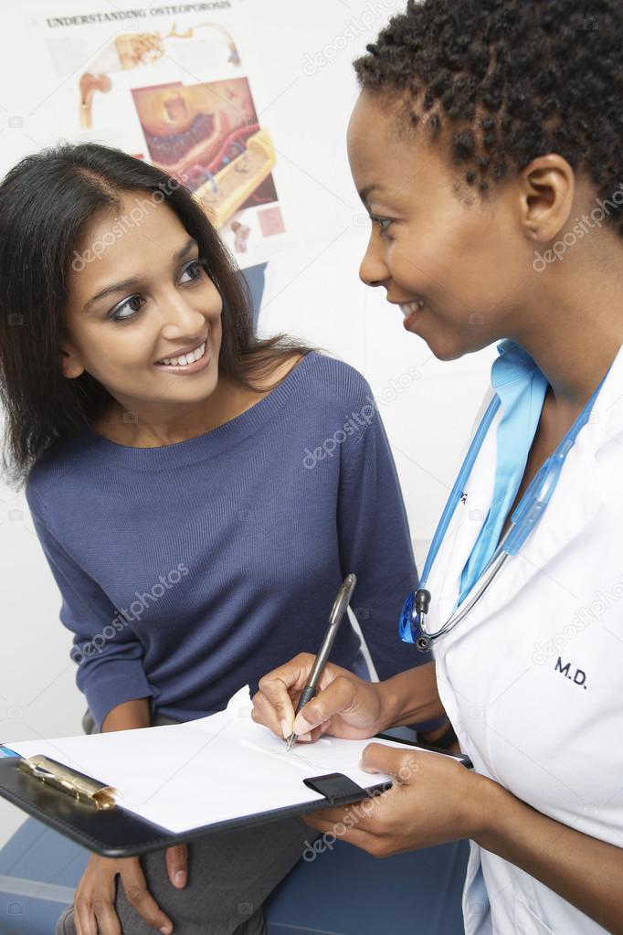 Doctor talking to Indian patient