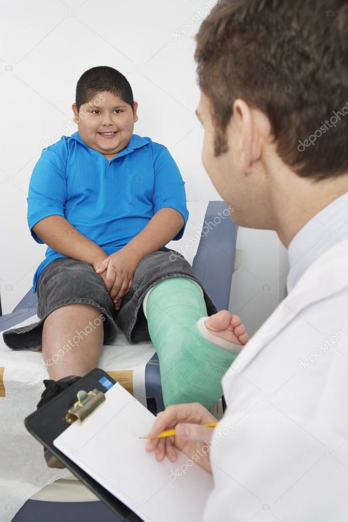 Doctor Interviewing Boy Patient