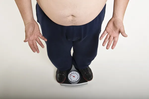 Man Measuring His Weight — Stock Photo, Image