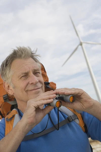 Senior Man With Binoculars At Wind Farm — Stock Photo, Image