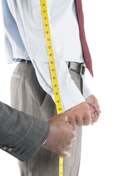 Tailor measuring shirt's sleeve — Stock Photo, Image