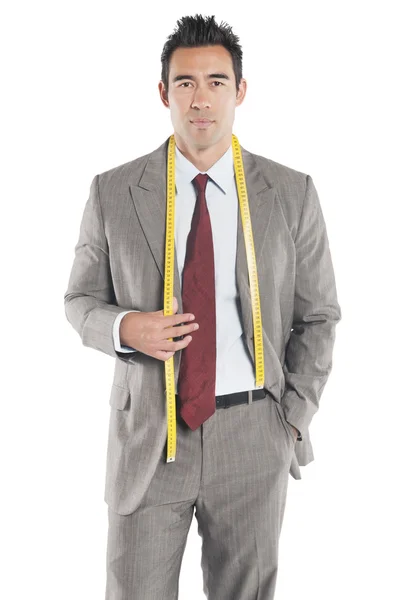 Portrait of handsome tailor standing over white background — Stock Photo, Image