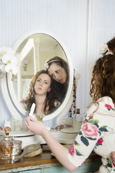 Sisters at dressing table — Stock Photo, Image