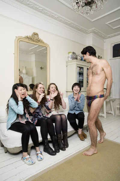 Male stripper performing in front of young females — Stock Photo, Image