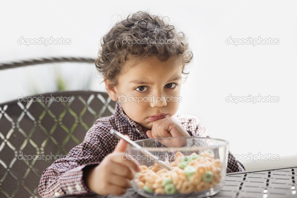 Grumpy child with breakfast