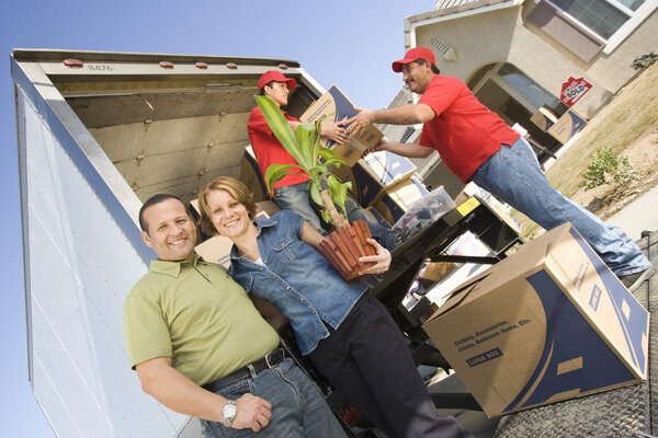Couple in front of delivery van