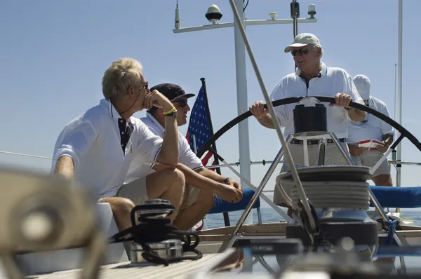 Sailors talking at Helm on Yacht — Stock Photo, Image