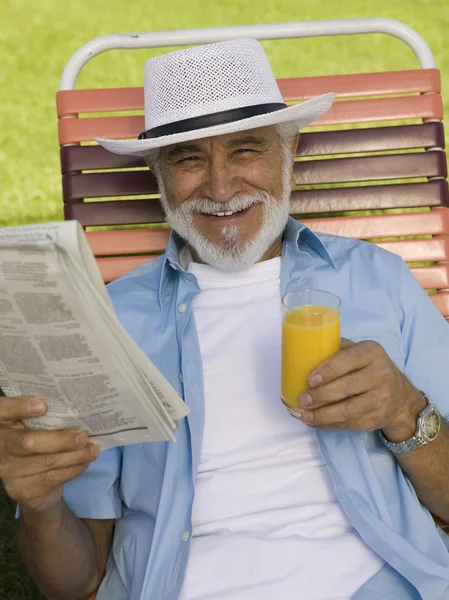 Senior Man sitting on Lawn Chair — Stock Photo, Image